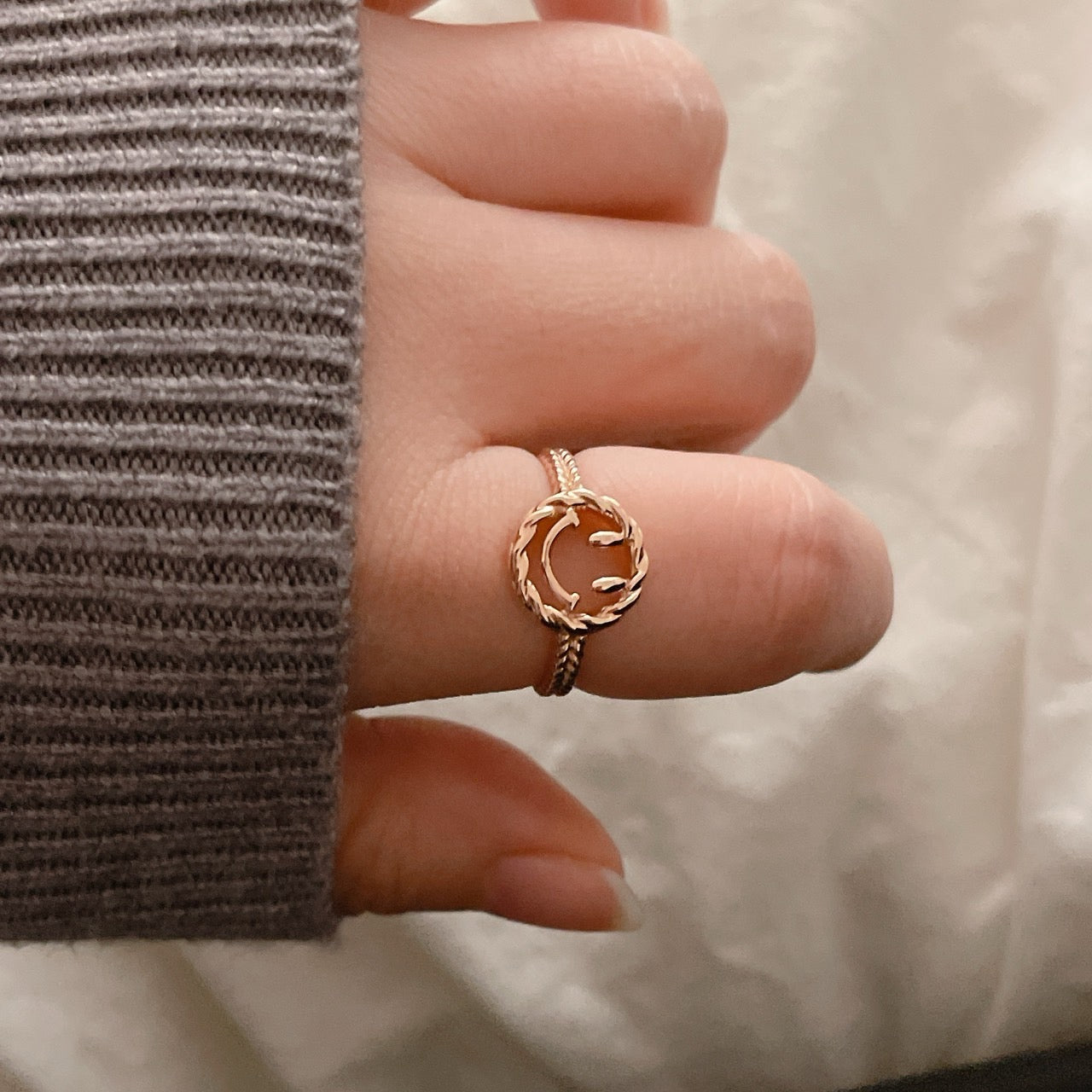 Happy Face Ring on a second finger
