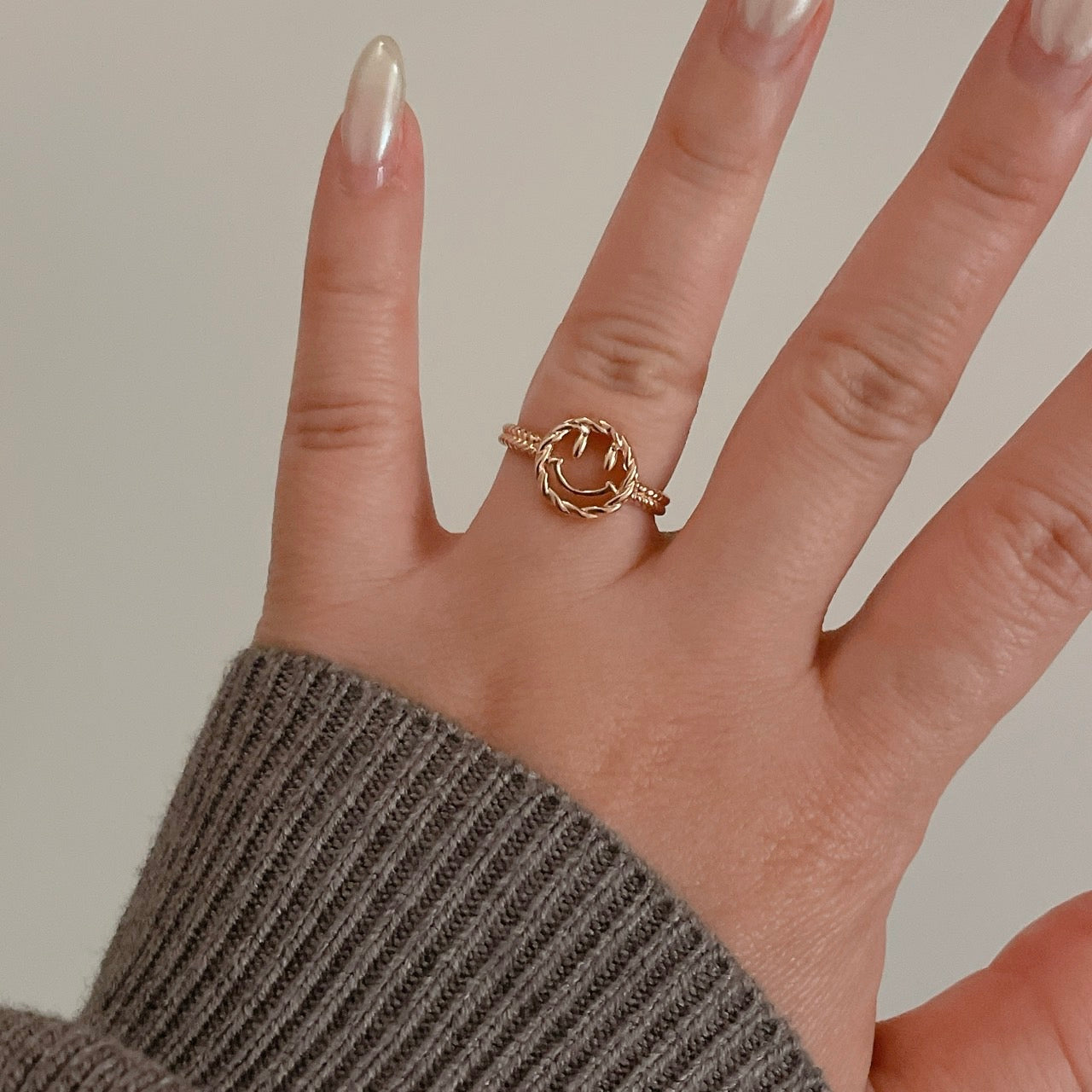 Happy Face Ring on a finger