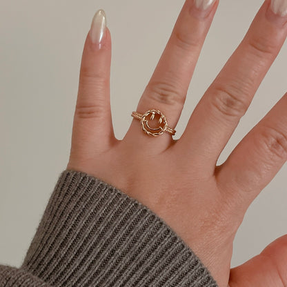 Happy Face Ring on a finger