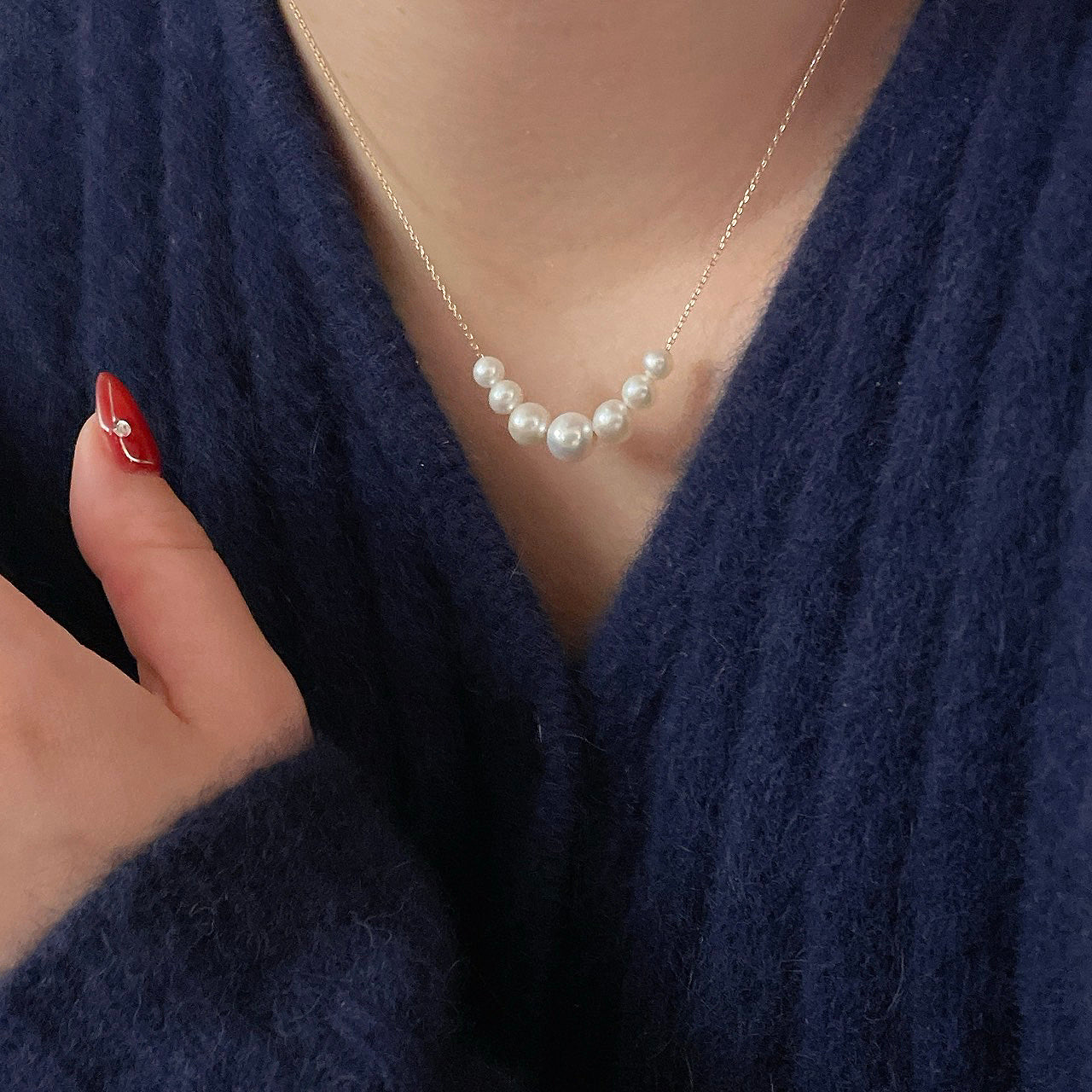 Model wearing Floating Pearl Necklace