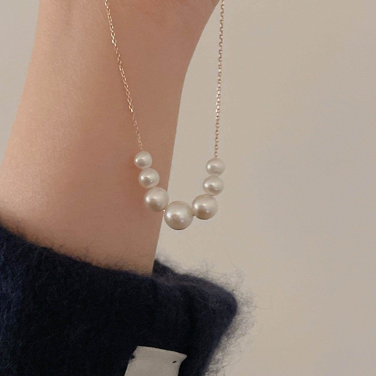 Floating Necklace held in hand