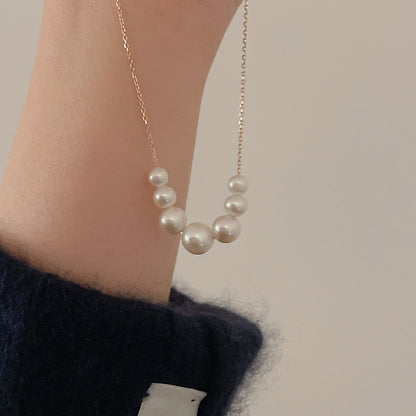 Floating Necklace held in hand